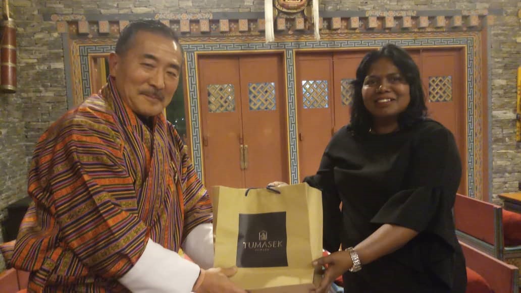 AIBD Interim Director presenting memento to Cabinet Secretary and Chair of BBS Board, Kezang Wangdi